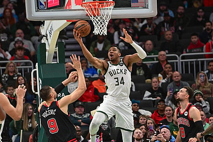 Nov 13, 2023; Milwaukee, Wisconsin, USA; Milwaukee Bucks forward Giannis Antetokounmpo (34) takes a shot against Chicago Bulls center Nikola Vucevic (9) in the first quarter at Fiserv Forum. Mandatory Credit: Benny Sieu-USA TODAY Sports