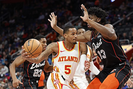 Nov 14, 2023; Detroit, Michigan, USA; Atlanta Hawks guard Dejounte Murray (5) dribbles defended by Detroit Pistons center James Wiseman (13) in the first half at Little Caesars Arena. Mandatory Credit: Rick Osentoski-USA TODAY Sports