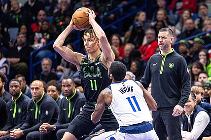 Nov 14, 2023; New Orleans, Louisiana, USA;  New Orleans Pelicans guard Dyson Daniels (11) looks to pass the ball against Dallas Mavericks guard Kyrie Irving (11) with acting head coach James Borrego looks on during the first half at the Smoothie King Center. Mandatory Credit: Stephen Lew-USA TODAY Sports