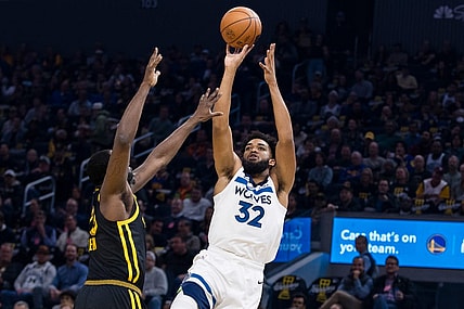 Nov 14, 2023; San Francisco, California, USA; Golden State Warriors forward Draymond Green (23) defends Minnesota Timberwolves forward Karl-Anthony Towns (32) during the first half at Chase Center. Mandatory Credit: John Hefti-USA TODAY Sports