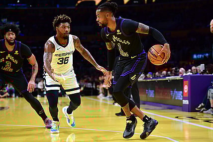 Nov 14, 2023; Los Angeles, California, USA; Los Angeles Lakers guard D   Angelo Russell (1) moves the ball against Memphis Grizzlies guard Marcus Smart (36) during the first half at Crypto.com Arena. Mandatory Credit: Gary A. Vasquez-USA TODAY Sports
