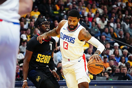 Nov 14, 2023; Denver, Colorado, USA;  LA Clippers forward Paul George (13) drives to the basket against Denver Nuggets guard Reggie Jackson (7) in the second quarter at Ball Arena. Mandatory Credit: Ron Chenoy-USA TODAY Sports