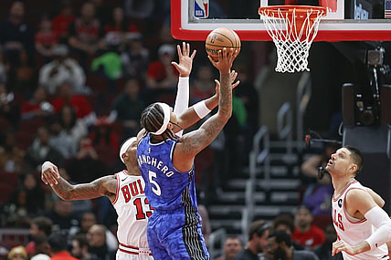 Nov 15, 2023; Chicago, Illinois, USA; Orlando Magic forward Paolo Banchero (5) shoots against Chicago Bulls forward Torrey Craig (13) during the first half at United Center. Mandatory Credit: Kamil Krzaczynski-USA TODAY Sports