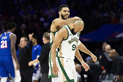 Nov 15, 2023; Philadelphia, Pennsylvania, USA; Boston Celtics forward Jayson Tatum (0) congratulates guard Derrick White (9) after his three pointer against the Philadelphia 76ers during the fourth quarter at Wells Fargo Center. Mandatory Credit: Bill Streicher-USA TODAY Sports