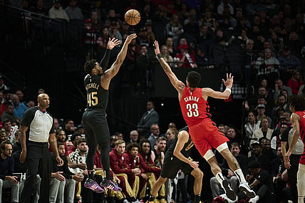 Nov 15, 2023; Portland, Oregon, USA; Cleveland Cavaliers guard Donovan Mitchell (45) shoots a basket during the first half against Portland Trail Blazers forward Toumani Camara (33) at Moda Center. Mandatory Credit: Troy Wayrynen-USA TODAY Sports