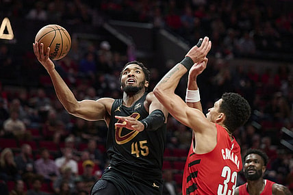 Nov 15, 2023; Portland, Oregon, USA; Cleveland Cavaliers guard Donovan Mitchell (45) drives to the basket during the second half against Portland Trail Blazers forward Toumani Camara (33) at Moda Center. Mandatory Credit: Troy Wayrynen-USA TODAY Sports