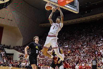 Nov 16, 2023; Bloomington, Indiana, USA; Indiana Hoosiers center Kel'el Ware (1) shoots the ball while Wright State Raiders center AJ Braun (12) defends in the first half at Simon Skjodt Assembly Hall. Mandatory Credit: Trevor Ruszkowski-USA TODAY Sports