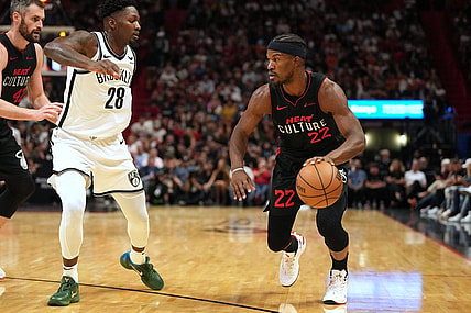 Nov 16, 2023; Miami, Florida, USA;  Miami Heat forward Jimmy Butler (22) drives to the basket as Brooklyn Nets forward Dorian Finney-Smith (28) defends in the first half at Kaseya Center. Mandatory Credit: Jim Rassol-USA TODAY Sports