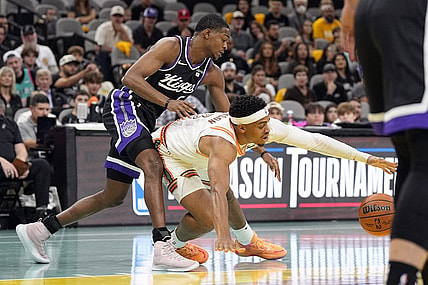 Nov 17, 2023; San Antonio, Texas, USA; Sacramento Kings guard De'Aaron Fox (5) and and San Antonio Spurs forward Keldon Johnson (3) battle for the loose ball during the first half at Frost Bank Center. Mandatory Credit: Scott Wachter-USA TODAY Sports