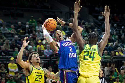 Oregon center Mahamadou Diawara fouls Tennessee State guard Christian Brown as the Oregon Ducks host Tennessee State Friday, Nov. 17, 2023, at Matthew Knight Arena in Eugene, Ore.