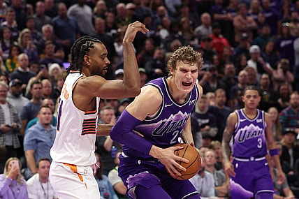 Nov 17, 2023; Salt Lake City, Utah, USA; Utah Jazz forward Lauri Markkanen (23) goes to the basket against Phoenix Suns forward Keita Bates-Diop (21) in the fourth quarter at Delta Center. Mandatory Credit: Rob Gray-USA TODAY Sports