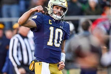 Nov 18, 2023; South Bend, Indiana, USA; Notre Dame Fighting Irish quarterback Sam Hartman (10) celebrates after throwing a touchdown pass in the second quarter against the Wake Forest Demon Deacons at Notre Dame Stadium. Mandatory Credit: Matt Cashore-USA TODAY Sports