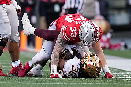 Nov 18, 2023; Columbus, Ohio, USA; Ohio State Buckeyes defensive end Jack Sawyer (33) tackles Minnesota Golden Gophers running back Jordan Nubin (30) during the first half of the NCAA football game at Ohio Stadium.