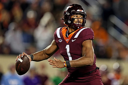 Nov 18, 2023; Blacksburg, Virginia, USA; Virginia Tech Hokies quarterback Kyron Drones (1) throws a pass during the fourth quarter against the North Carolina State Wolfpack at Lane Stadium. Mandatory Credit: Peter Casey-USA TODAY Sports