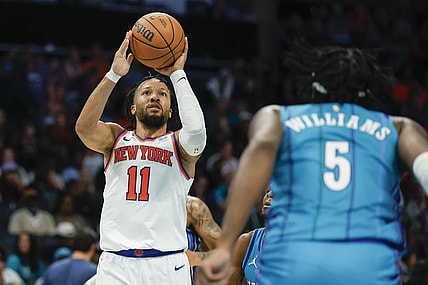 Nov 18, 2023; Charlotte, North Carolina, USA; New York Knicks guard Jalen Brunson (11) shoots the ball over Charlotte Hornets center Mark Williams (5) during the second half at Spectrum Center. Mandatory Credit: Nell Redmond-USA TODAY Sports