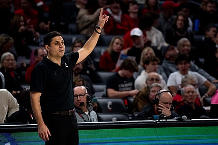 Cincinnati Bearcats head coach Wes Miller speaks to his players in the first half of the NCAA basketball game between the Cincinnati Bearcats and the Northern Kentucky Norse at Fifth Third Arena in Cincinnati on Sunday, Nov. 19, 2023.