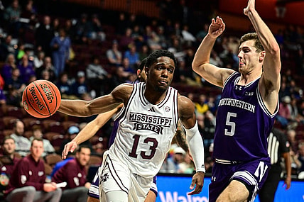 Nov 19, 2023; Uncasville, CT, USA;  Mississippi State Bulldogs guard Josh Hubbard (13) dribbles the ball challenged by Northwestern Wildcats guard Ryan Langborg (5) during the second halfat Mohegan Sun Arena. Mandatory Credit: Mark Smith-USA TODAY Sports