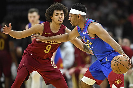Nov 19, 2023; Cleveland, Ohio, USA; Denver Nuggets guard Jalen Pickett (24) drives against Cleveland Cavaliers guard Craig Porter (9) in the fourth quarter at Rocket Mortgage FieldHouse. Mandatory Credit: David Richard-USA TODAY Sports
