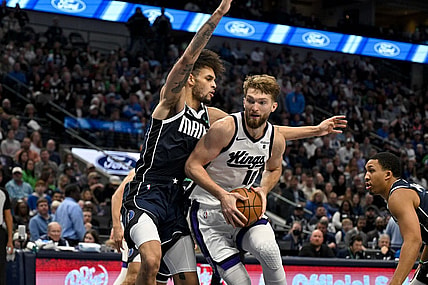 Nov 19, 2023; Dallas, Texas, USA; Sacramento Kings forward Domantas Sabonis (10) looks to move to the basket past Dallas Mavericks center Dereck Lively II (2) during the second half at the American Airlines Center. Mandatory Credit: Jerome Miron-USA TODAY Sports