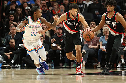 Nov 19, 2023; Portland, Oregon, USA;  Portland Trail Blazers guard Skylar Mays (5) dribbles up the court past Oklahoma City Thunder guard Cason Wallace (22) in the first half at Moda Center. Mandatory Credit: Jaime Valdez-USA TODAY Sports