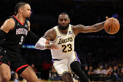 Nov 19, 2023; Los Angeles, California, USA;  Los Angeles Lakers forward LeBron James (23) dribbles against Houston Rockets forward Dillon Brooks (9) during the second quarter at Crypto.com Arena. Mandatory Credit: Kiyoshi Mio-USA TODAY Sports