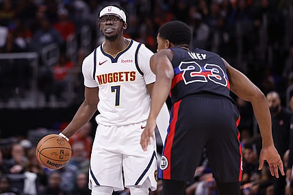 Nov 20, 2023; Detroit, Michigan, USA;  Denver Nuggets guard Reggie Jackson (7) dribbles defended by Detroit Pistons guard Jaden Ivey (23) in the first half at Little Caesars Arena. Mandatory Credit: Rick Osentoski-USA TODAY Sports