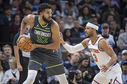 Nov 20, 2023; Minneapolis, Minnesota, USA; Minnesota Timberwolves center Karl-Anthony Towns (32) looks to pass the ball over New York Knicks guard Josh Hart (3) in the first half at Target Center. Mandatory Credit: Jesse Johnson-USA TODAY Sports