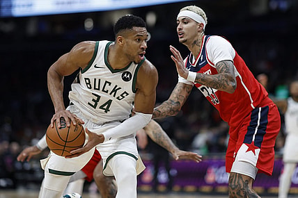 Nov 20, 2023; Washington, District of Columbia, USA; Milwaukee Bucks forward Giannis Antetokounmpo (34) drives to the basket as Washington Wizards forward Kyle Kuzma (33) defends in the fourth quarter at Capital One Arena. Mandatory Credit: Geoff Burke-USA TODAY Sports