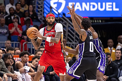 Nov 20, 2023; New Orleans, Louisiana, USA;  New Orleans Pelicans forward Brandon Ingram (14) looks to pass the ball against Sacramento Kings guard Malik Monk (0) during the second half at the Smoothie King Center. Mandatory Credit: Stephen Lew-USA TODAY Sports