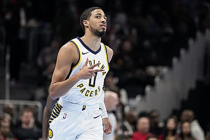Nov 21, 2023; Atlanta, Georgia, USA; Indiana Pacers guard Tyrese Haliburton (0) reacts after a three point basket against the Atlanta Hawks during the first half at State Farm Arena. Mandatory Credit: Dale Zanine-USA TODAY Sports