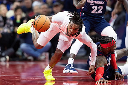 Nov 21, 2023; Philadelphia, Pennsylvania, USA; Cleveland Cavaliers guard Darius Garland (10) picks up a loose ball past Philadelphia 76ers forward Robert Covington (33) during the fourth quarter at Wells Fargo Center. Mandatory Credit: Bill Streicher-USA TODAY Sports