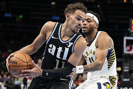 Nov 21, 2023; Atlanta, Georgia, USA; Atlanta Hawks guard Trae Young (11) tries to get past Indiana Pacers forward Bruce Brown (11) during the second half at State Farm Arena. Mandatory Credit: Dale Zanine-USA TODAY Sports