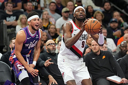 Nov 21, 2023; Phoenix, Arizona, USA; Phoenix Suns guard Devin Booker (1) shouts from the bench as Portland Trail Blazers forward Jerami Grant (9) shoots during the second half at Footprint Center. Mandatory Credit: Joe Camporeale-USA TODAY Sports