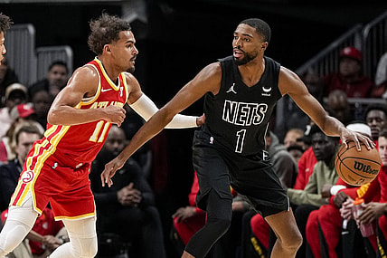 Nov 22, 2023; Atlanta, Georgia, USA; Atlanta Hawks guard Trae Young (11) defends against Brooklyn Nets forward Mikal Bridges (1) during the first half at State Farm Arena. Mandatory Credit: Dale Zanine-USA TODAY Sports