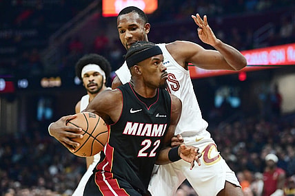 Nov 22, 2023; Cleveland, Ohio, USA; Miami Heat forward Jimmy Butler (22) drives to the basket against Cleveland Cavaliers forward Evan Mobley (4) during the first quarter at Rocket Mortgage FieldHouse. Mandatory Credit: Ken Blaze-USA TODAY Sports