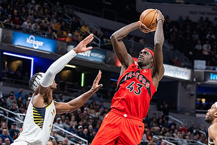 Nov 22, 2023; Indianapolis, Indiana, USA; Toronto Raptors forward Pascal Siakam (43) shoots the ball while Indiana Pacers guard Buddy Hield (left) defends in the first half at Gainbridge Fieldhouse. Mandatory Credit: Trevor Ruszkowski-USA TODAY Sports