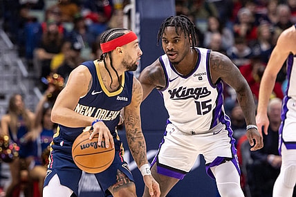 Nov 22, 2023; New Orleans, Louisiana, USA; New Orleans Pelicans guard Jose Alvarado (15) dribbles against Sacramento Kings guard Davion Mitchell (15) during the first half at the Smoothie King Center. Mandatory Credit: Stephen Lew-USA TODAY Sports