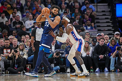 Nov 22, 2023; Minneapolis, Minnesota, USA; Philadelphia 76ers forward Robert Covington (33) defends Minnesota Timberwolves center Karl-Anthony Towns (32) in the second quarter at Target Center. Mandatory Credit: Brad Rempel-USA TODAY Sports