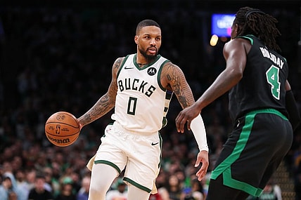 Nov 22, 2023; Boston, Massachusetts, USA; Milwaukee Bucks guard Damian Lillard (0) dribbles down the court during the second half against the Boston Celtics at TD Garden. Mandatory Credit: Paul Rutherford-USA TODAY Sports