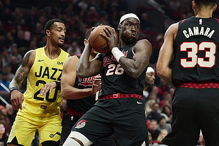 Nov 22, 2023; Portland, Oregon, USA; Portland Trail Blazers center Duop Reath (26) grabs an defensive rebound during the first half against the Utah Jazz at Moda Center. Mandatory Credit: Troy Wayrynen-USA TODAY Sports