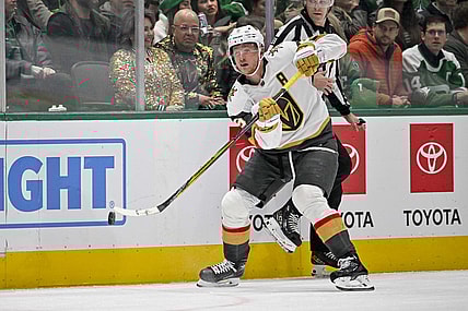 Nov 22, 2023; Dallas, Texas, USA; Vegas Golden Knights center Jack Eichel (9) passes the puck against the Dallas Stars during the third period at the American Airlines Center. Mandatory Credit: Jerome Miron-USA TODAY Sports