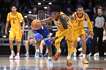 Nov 23, 2023; La Jolla, California, USA; USC Trojans guard Boogie Ellis (5) grabs a loose ball during the first half against the Seton Hall Pirates at LionTree Arena. Mandatory Credit: Orlando Ramirez-USA TODAY Sports