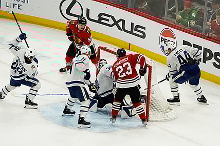 Nov 24, 2023; Chicago, Illinois, USA; Chicago Blackhawks defenseman Kevin Korchinski (55) scores the game winning goal during an overtime period against the Toronto Maple Leafs at United Center. Mandatory Credit: David Banks-USA TODAY Sports