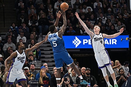 Nov 24, 2023; Minneapolis, Minnesota, USA; Sacramento Kings forward Harrison Barnes (40) and guard Kevin Huerter (9) defend the shot of Minnesota Timberwolves guard Anthony Edwards (5) during the first quarter at Target Center. Mandatory Credit: Jeffrey Becker-USA TODAY Sports