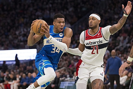 Nov 24, 2023; Milwaukee, Wisconsin, USA;  Milwaukee Bucks forward Giannis Antetokounmpo (34) drives for the basket against Washington Wizards center Daniel Gafford (21) during the fourth quarter at Fiserv Forum. Mandatory Credit: Jeff Hanisch-USA TODAY Sports