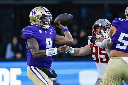 Nov 25, 2023; Seattle, Washington, USA; Washington Huskies quarterback Michael Penix Jr. (9) passes against the Washington State Cougars during the first quarter at Alaska Airlines Field at Husky Stadium. Mandatory Credit: Joe Nicholson-USA TODAY Sports