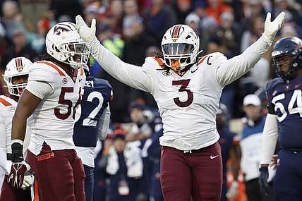 Nov 25, 2023; Charlottesville, Virginia, USA; Virginia Tech Hokies defensive lineman Norell Pollard (3) celebrates after recording a sack against the Virginia Cavaliers during the second quarter at Scott Stadium. Mandatory Credit: Geoff Burke-USA TODAY Sports