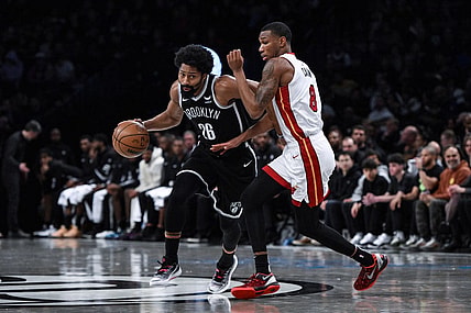 Nov 25, 2023; Brooklyn, New York, USA; Brooklyn Nets guard Spencer Dinwiddie (26) drives against Miami Heat forward Jamal Cain (8) during the third quarter at Barclays Center. Mandatory Credit: John Jones-USA TODAY Sports