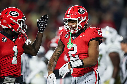 Nov 25, 2023; Atlanta, Georgia, USA; Georgia Bulldogs running back Kendall Milton (2) celebrates with wide receiver Marcus Rosemy-Jacksaint (1) after a touchdown against the Georgia Tech Yellow Jackets in the second quarter at Bobby Dodd Stadium at Hyundai Field. Mandatory Credit: Brett Davis-USA TODAY Sports