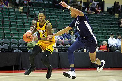 Nov 26, 2023; Kissimmee, FL, USA;  Virginia Commonwealth Rams guard Zeb Jackson (2) drives to the basket past Penn State Nittany Lions forward Puff Johnson (4) in the first half during the ESPN Invitational Events tournament seventh place game at State Farm Field House. Mandatory Credit: Nathan Ray Seebeck-USA TODAY Sports
